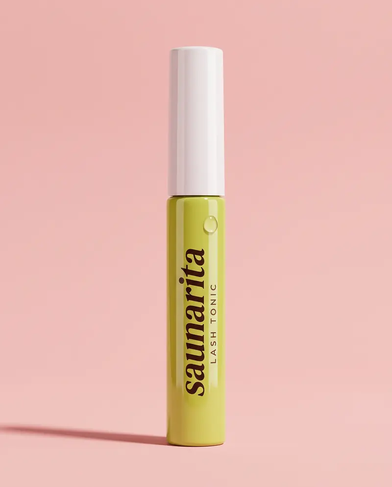 Lash Tonic conditioner in a lime tube on a pink background